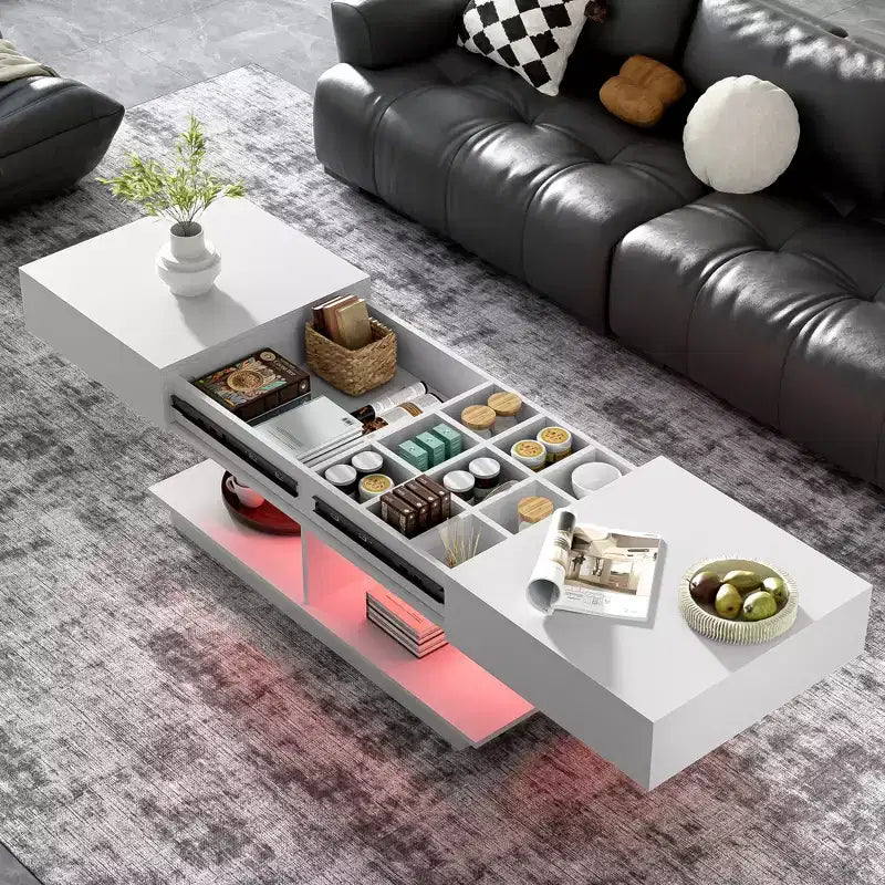 Table basse modulable avec espace de rangement dissimulé.