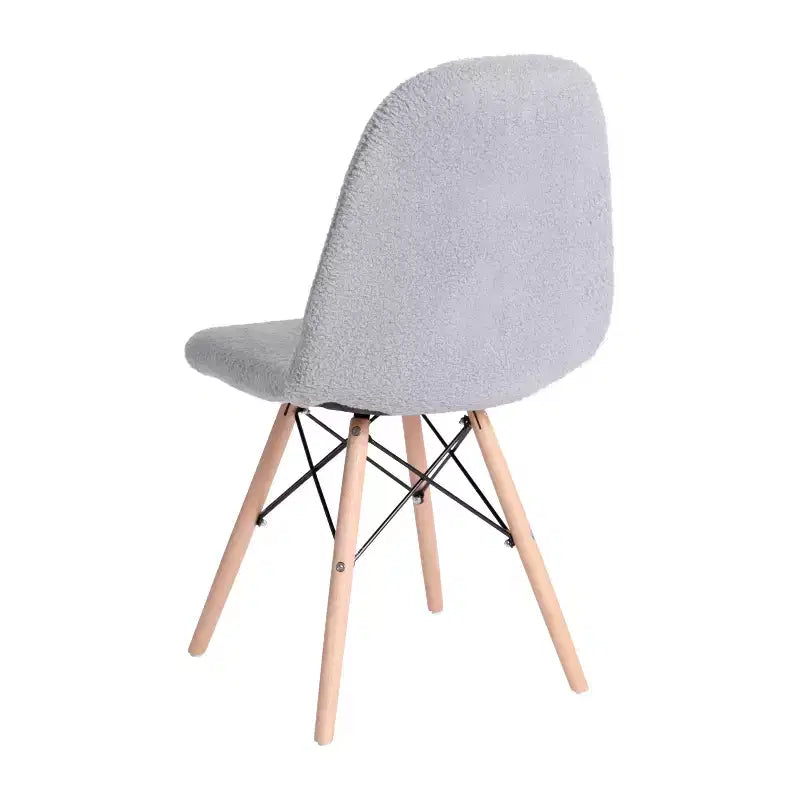 Fauteuil lounge en fausse peau de mouton avec pieds en hêtre
